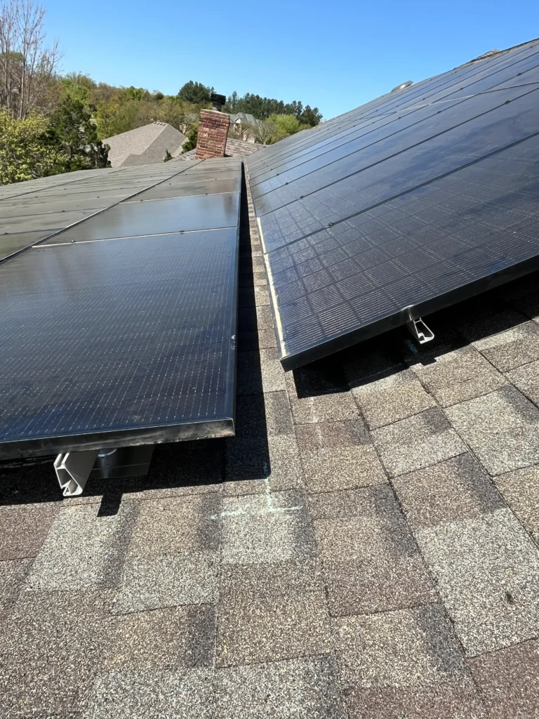 ready for installation - solar panels stacked on a roof