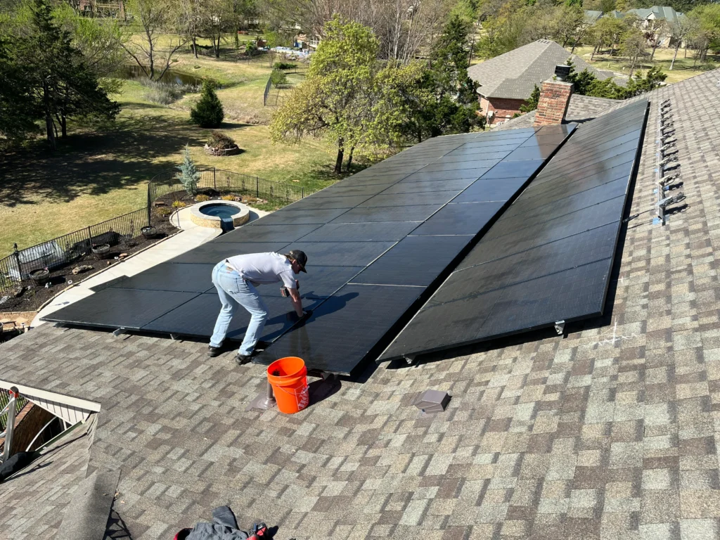 team members work hard on a customers solar panel installation