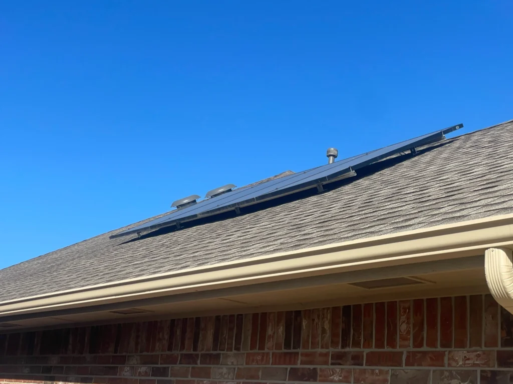 after install. new solar panels on a customers roof ready for energy savings.