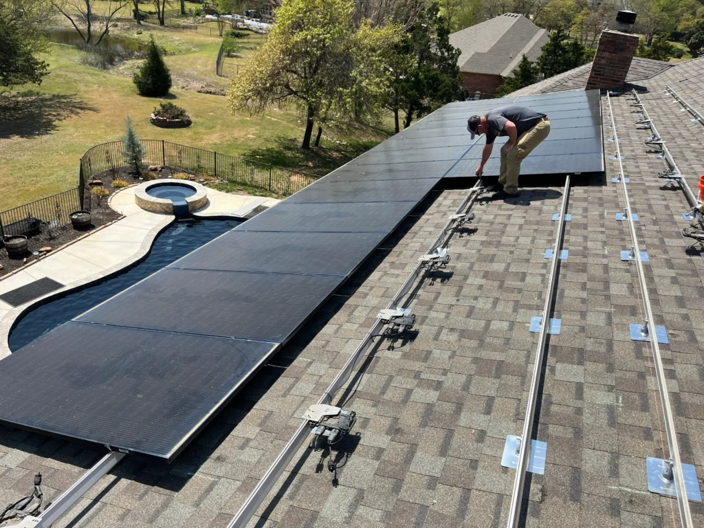 second row of new solar panels being installed on a customers roof