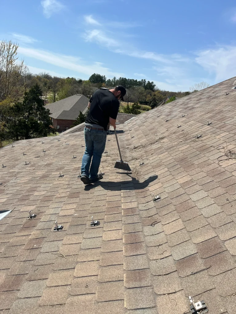 working hard at beginning prep work on a customers roof